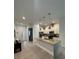 Modern kitchen features stainless steel appliances, a center island, and pendant lighting at 7544 Sunville Ave # 7544, Kissimmee, FL 34747