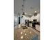 Modern kitchen features stainless steel appliances, a center island, and pendant lighting at 7544 Sunville Ave # 7544, Kissimmee, FL 34747