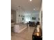 Modern kitchen features stainless steel appliances, a center island, and pendant lighting at 7544 Sunville Ave # 7544, Kissimmee, FL 34747