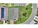 Birds eye view of single Gathering home, lush lawn, brick driveway, and solar panels at 801 Ashton Dr, Davenport, FL 33837