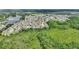 Aerial view of community nestled amid lush greenery, trees, and ponds at 801 Ashton Dr, Davenport, FL 33837