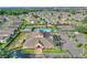Aerial of the community center, swimming pool, tennis, and shuffleboard courts within a residential neighborhood at 801 Ashton Dr, Davenport, FL 33837