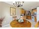 Cozy dining area with a round table, chandelier, and kitchen views at 801 Ashton Dr, Davenport, FL 33837