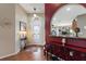 Inviting entryway with hardwood floors, decorative accents, and a view into the living spaces at 801 Ashton Dr, Davenport, FL 33837