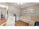 This home office is well-lit and features comfortable seating at 801 Ashton Dr, Davenport, FL 33837