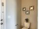 Cozy half bathroom with decorative mirrors and tiled floors at 8039 Oak Shadow Ct, Davenport, FL 33837