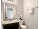 Powder room featuring granite counters and decorative towel at 8039 Oak Shadow Ct, Davenport, FL 33837