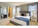 Cozy bedroom with swan towel art, large mirror, and ensuite bathroom at 8039 Oak Shadow Ct, Davenport, FL 33837