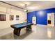 Well-lit game room with a pool table, comfortable seating, and stylish decor; ideal for recreation at 8039 Oak Shadow Ct, Davenport, FL 33837