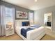 Elegant main bedroom featuring a king bed, stylish decor, and lots of natural light at 8039 Oak Shadow Ct, Davenport, FL 33837