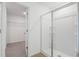 Bright bathroom featuring glass shower with ceramic tile flooring at 816 Lake Dell Rd, Dundee, FL 33838