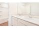 Bright bathroom featuring a double sink vanity with white cabinets and a shower-tub combo at 824 Lake Dell Rd, Dundee, FL 33838