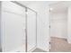 Contemporary bathroom with a glass-enclosed shower and a walk-in closet at 824 Lake Dell Rd, Dundee, FL 33838