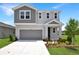 Charming home showcasing modern architectural design, lush front lawn and landscaped yard at 824 Lake Dell Rd, Dundee, FL 33838
