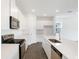 Modern kitchen featuring white cabinets, stainless steel appliances, and a spacious center island at 824 Lake Dell Rd, Dundee, FL 33838