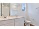 Bathroom with large mirror, double sinks, and tiled floors at 832 Lake Dell Rd, Dundee, FL 33838
