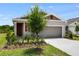 Charming single-story home with a two-car garage and well-manicured lawn, offering great curb appeal at 832 Lake Dell Rd, Dundee, FL 33838