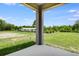 Covered patio with view of green space at 832 Lake Dell Rd, Dundee, FL 33838