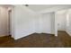 An open room with wood-look tile flooring, white walls, and recessed lighting, providing a versatile space at 832 Lake Dell Rd, Dundee, FL 33838