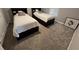 Comfortable bedroom with plush carpet, window shutters, and two beds at 9803 Sweetleaf St, Orlando, FL 32827