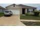 Charming single-story home with a two-car garage and well-maintained lawn at 1104 Star Ruby Ln, Winter Haven, FL 33880