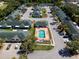 Aerial view of neighborhood community including pool, townhomes, and parking at 1150 Jade East Ln, Kissimmee, FL 34744