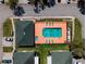 Aerial view of community pool and hot tub with green spaces at 1150 Jade East Ln, Kissimmee, FL 34744