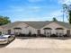 Charming single-story duplex with off-street parking, manicured landscaping, and neutral exterior color scheme at 1150 Jade East Ln, Kissimmee, FL 34744