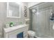 Bright bathroom featuring a sink, toilet and shower at 121 Lochness Ln, Kissimmee, FL 34743