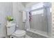 Bright bathroom features toilet and updated shower at 121 Lochness Ln, Kissimmee, FL 34743
