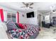 Bright primary bedroom features sleek TV and luxurious decor at 121 Lochness Ln, Kissimmee, FL 34743