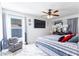 Bright bedroom features sleek ceiling fan, TV and luxurious decor at 121 Lochness Ln, Kissimmee, FL 34743