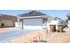 A white single-Gathering home with a two-car garage and a spacious driveway at 121 Lochness Ln, Kissimmee, FL 34743