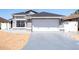 Inviting single-Gathering home with a two-car garage and an expansive driveway at 121 Lochness Ln, Kissimmee, FL 34743