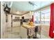Well-lit kitchen featuring white cabinetry, stone countertops, and stainless appliances at 121 Lochness Ln, Kissimmee, FL 34743