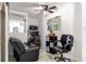 Office space with a black leather recliner, computer desk, and light-filled room at 121 Lochness Ln, Kissimmee, FL 34743