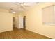 Comfortable bedroom with wood flooring, neutral walls, and ceiling fan at 127 Club Villas Ln, Kissimmee, FL 34744