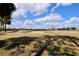 Sunny golf course scene featuring a sand trap at 127 Club Villas Ln, Kissimmee, FL 34744