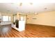 Large eat in kitchen features stainless steel appliances, granite countertops, and wood flooring at 127 Club Villas Ln, Kissimmee, FL 34744