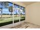 Screened patio with views of the lush green golf course at 127 Club Villas Ln, Kissimmee, FL 34744