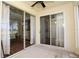 Tiled patio area with sliding glass doors leading to the interior at 127 Club Villas Ln, Kissimmee, FL 34744