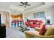 Open-concept living area with adjacent kitchen featuring a breakfast bar and comfortable seating arrangement at 1311 Seven Eagles Ct # 202, Reunion, FL 34747
