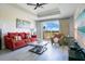 Cozy living room featuring hardwood floors, a bright window view, and contemporary decor at 1311 Seven Eagles Ct # 202, Reunion, FL 34747