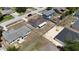 Overhead view of a home showcasing a screened patio, fenced yard, and surrounding neighborhood at 15106 Sw 38Th Cir, Ocala, FL 34473