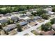 Expansive aerial shot of a neighborhood featuring diverse homes surrounded by mature trees at 15106 Sw 38Th Cir, Ocala, FL 34473