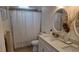 Bright bathroom featuring double sink vanity, modern fixtures, and a shower at 15106 Sw 38Th Cir, Ocala, FL 34473