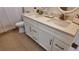 Bathroom featuring double vanity with modern faucets and white cabinets at 15106 Sw 38Th Cir, Ocala, FL 34473