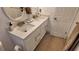 Bathroom with double vanity, modern sink faucets, and white cabinets at 15106 Sw 38Th Cir, Ocala, FL 34473