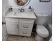 Bathroom with modern vanity, granite countertop, and storage underneath at 15106 Sw 38Th Cir, Ocala, FL 34473