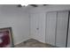 A bright bedroom featuring sliding closet doors, neutral walls, and a ceiling fan at 15106 Sw 38Th Cir, Ocala, FL 34473
